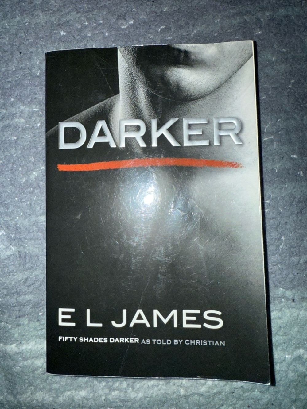 DARKER by E L James - Black Paperback with Red Accent